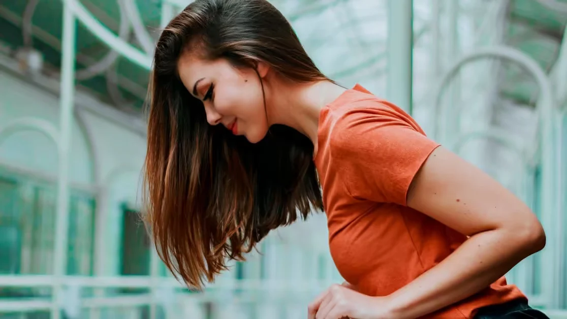 A woman in profile with long hair falling across her shoulder