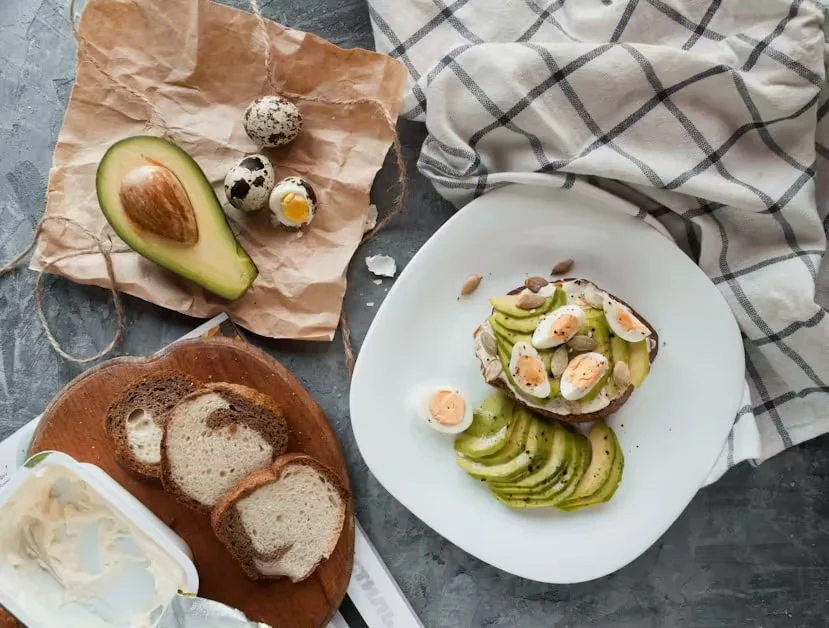 Avocado toast topped with quail eggs and seeds