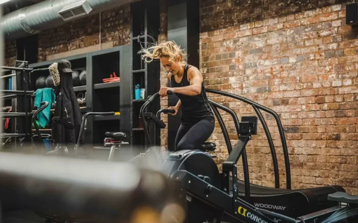 A woman running on a gym treadmill