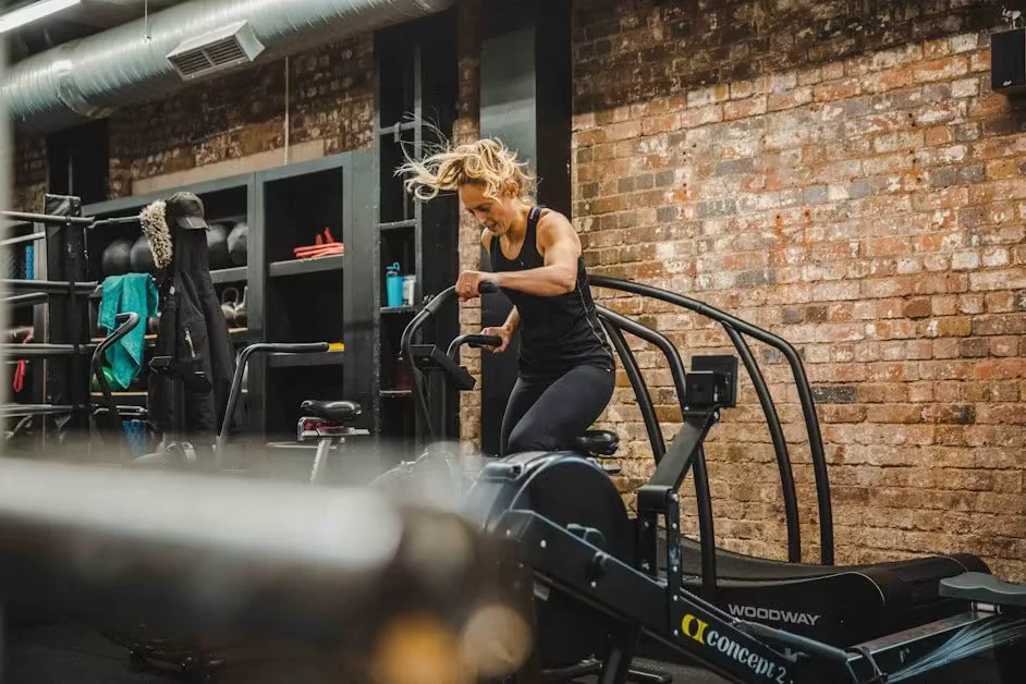 A woman running on a gym treadmill