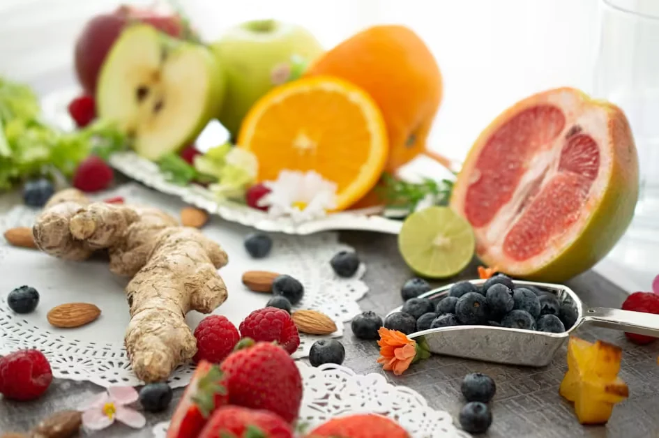 Fresh fruit, berries and ginger arranged on a table