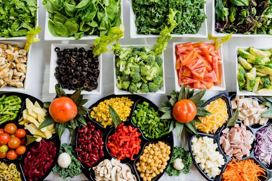 A tray of vegetables, legumes and dried fruit in compartments
